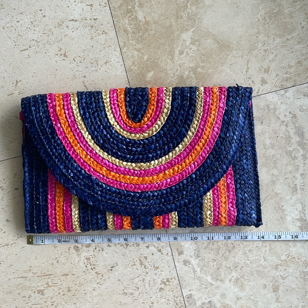 NEW without tags. Straw clutch, snap closure, interior pocket